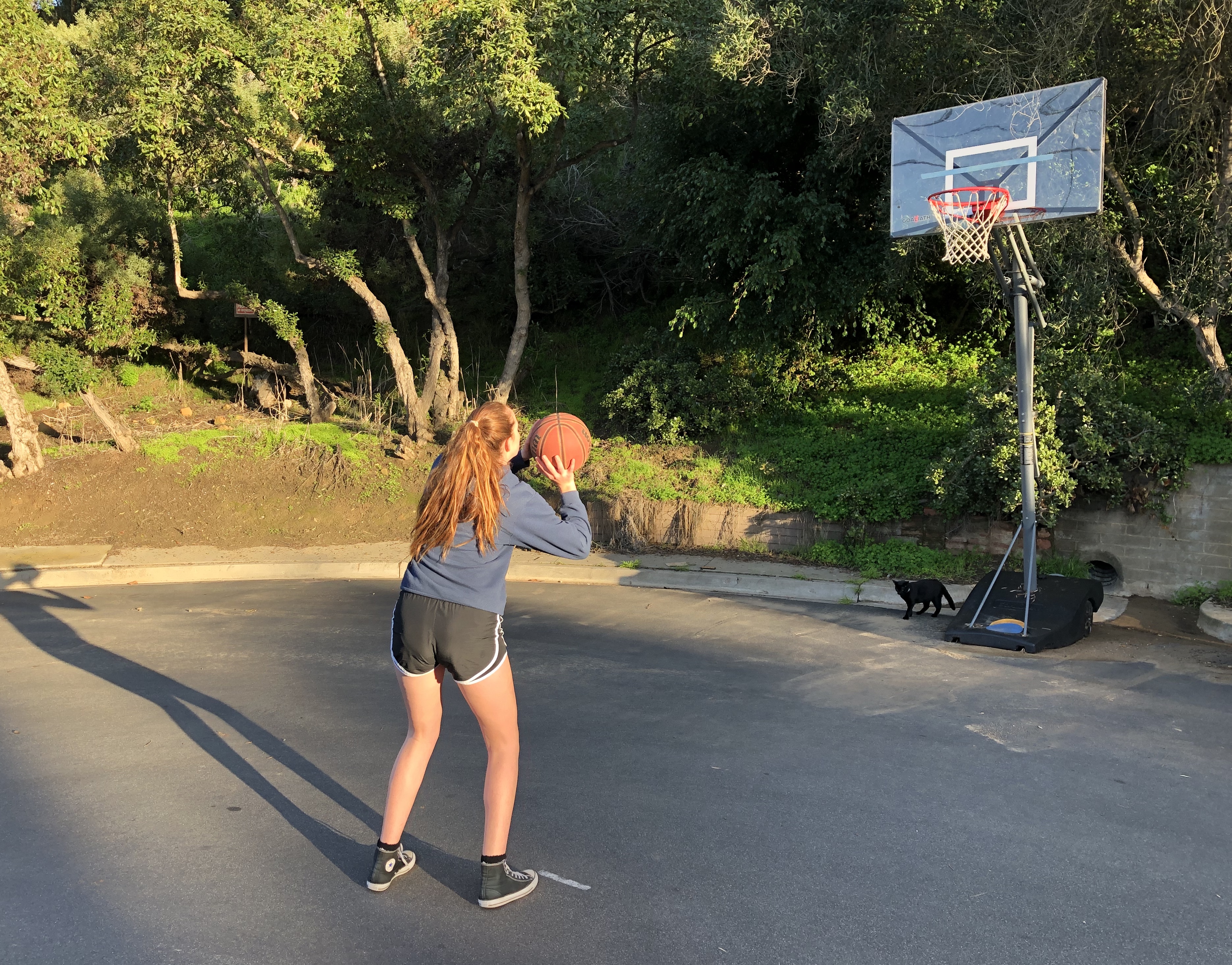 Emma practicing free throws outside